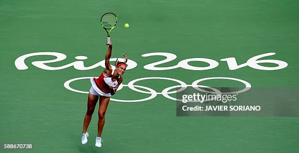 Puerto Rico's Monica Puig serves the ball to Czech Republic's Petra Kvitova during their women's singles semi-finals tennis match at the Olympic...