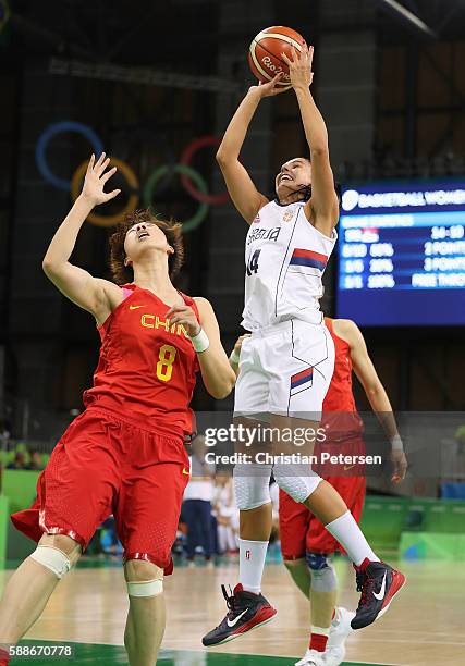 Ana Dabovic of Serbia attmepts a shot over di Wu of China during the women's basketball game on Day 7 of the Rio 2016 Olympic Games at the Youth...