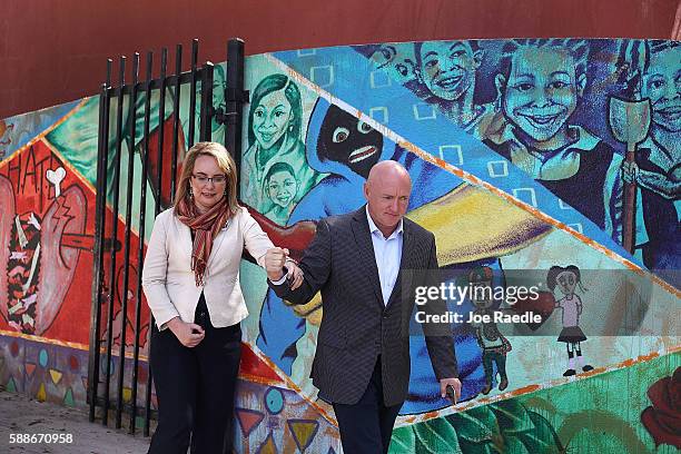 Former Rep. Gabrielle Giffords walks with her husband retired NASA astronaut Mark Kelly after joining with anti-gun violence activists and victims'...