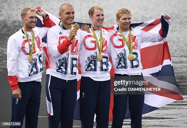 Britain's Mohamed Sbihi, Alex Gregory, Constantine Louloudis and George Nash pose with their gold medals on the podium of the Men's Four final rowing...