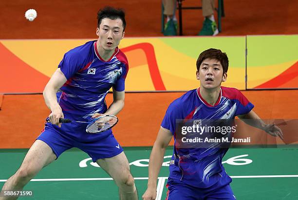 Yong Dae Lee and Yeon Seong Yoo of Republic of Korea competes against Sheng Mu Lee and Chia Hsin Tsai of Taipei in the badminton Men's Doubles Group...