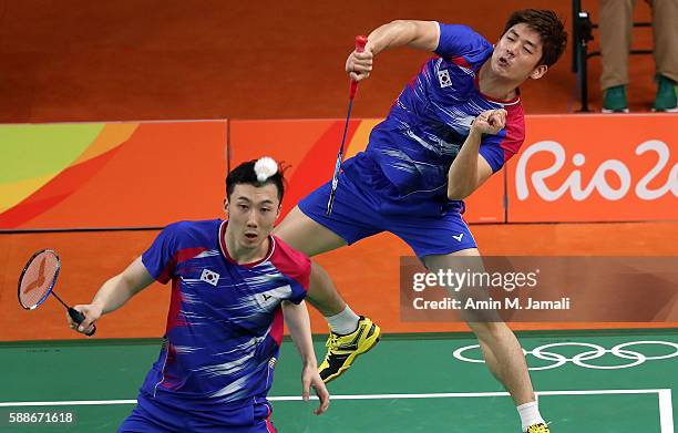 Yong Dae Lee and Yeon Seong Yoo of Republic of Korea competes against Sheng Mu Lee and Chia Hsin Tsai of Taipei in the badminton Men's Doubles Group...