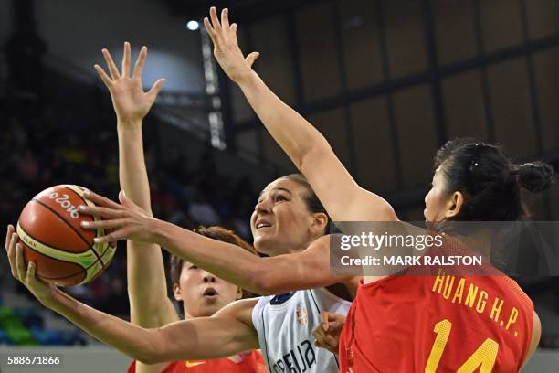 Serbia's forward Sonja Petrovic goes to the basket between China's guard Wu Di and China's centre Huang Hongpin during a Women's round Group B...