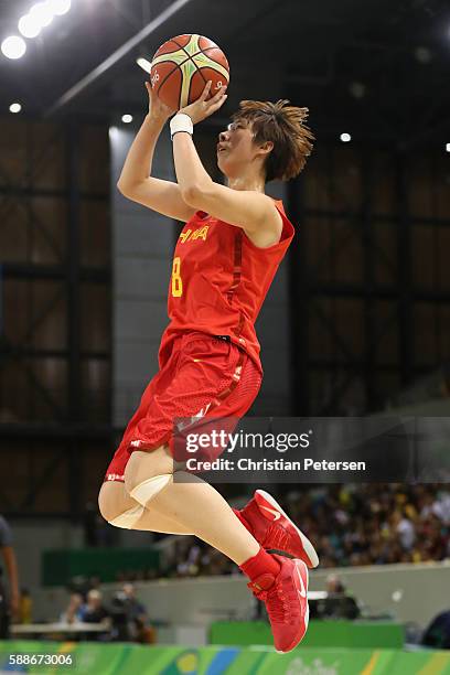 Di Wu of China attempts a shot against Serbia during the women's basketball game on Day 7 of the Rio 2016 Olympic Games at the Youth Arena on August...
