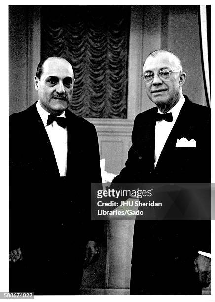 President of Johns Hopkins Univeristy Milton Stover Eisenhower shakes hands with President of Mexico Adolfo Lopez Mateos at Johns Hopkins...