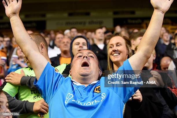 Fan of Wolverhampton Wanderers celebrates during the EFL Cup match between Wolverhampton Wanderers and Crawley Town at Molineux on August 8, 2016 in...