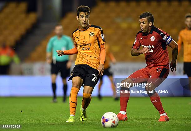 Joao Teixeira of Wolverhampton Wanderers and Jimmy Smith of Crawley Town during the EFL Cup match between Wolverhampton Wanderers and Crawley Town at...