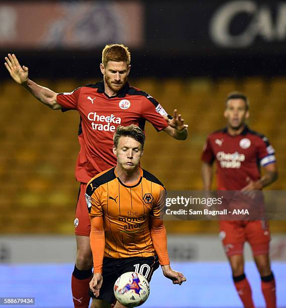 Joe Mason of Wolverhampton Wanderers and Matt Harrold of Crawley Town during the EFL Cup match between Wolverhampton Wanderers and Crawley Town at...