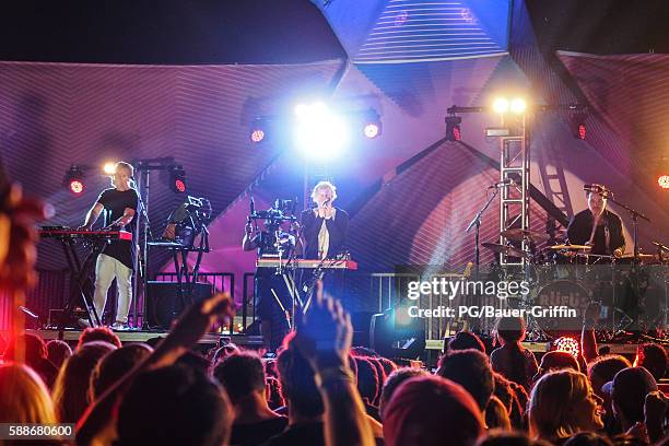 Jon George, Tyrone Lindqvist and James Hunt of Rufus du Sol perform on the Santa Monica Pier on August 11, 2016 in Los Angeles, California.
