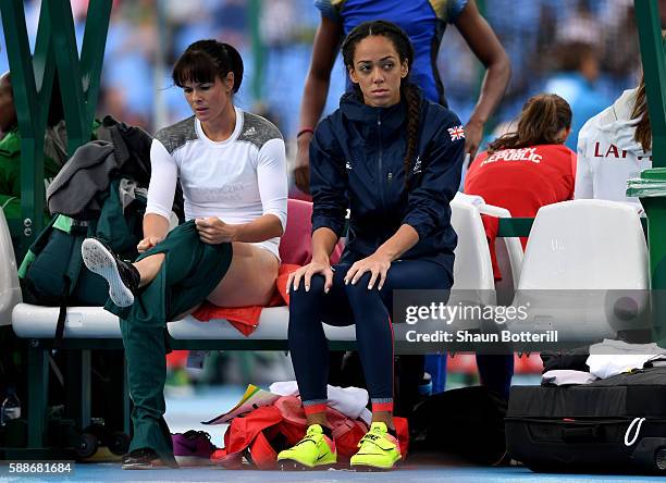 Katarina Johnson-Thompson of Great Britain and Gyorgyi Zsivoczky-Farkas of Hungary look on during the Women's Heptathlon High Jump on Day 7 of the...