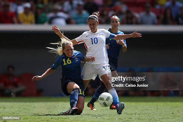 Carli Lloyd of United States controls the ball against Elin Rubensson of Sweden in the first half during the Women's Football Quarterfinal match at...
