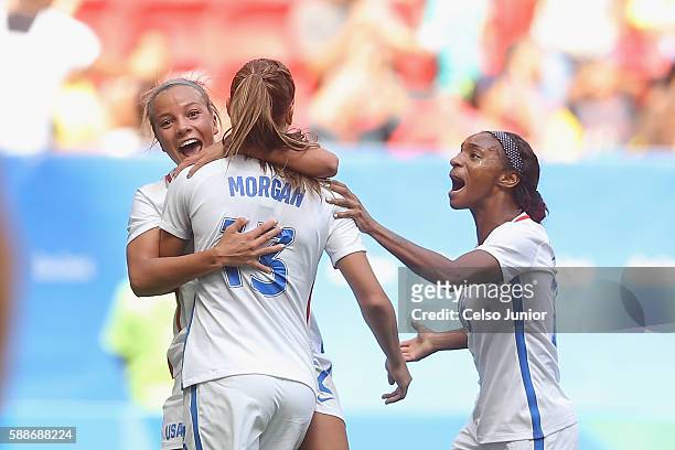 Alex Morgan of United States celebrates her goal to tie the game with teammates Mallory Pugh and Crystal Dunn in the second half against Sweden...