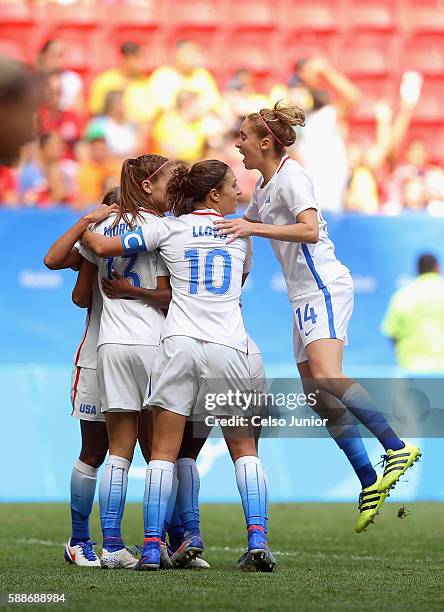 Alex Morgan of United States celebrates her goal with teammates after tying the game in the second half against Sweden during the Women's Football...