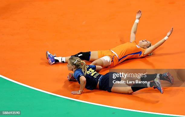 Estavana Polman of Netherlands lies on the flour during the Womens Preliminary Group B match between Sweden and Netherlands on Day 7 of the Rio 2016...