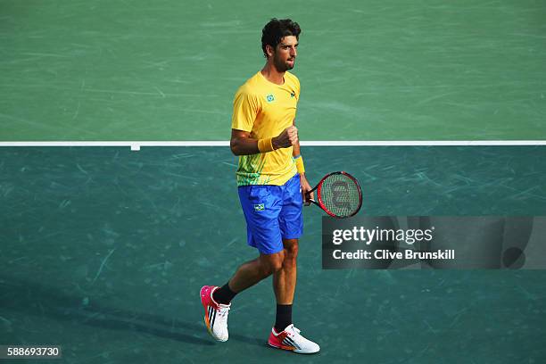 Thomaz Bellucci of Brazil celebrates winning the first set 6-2 against Rafael Nadal of Spain in the Men's Singles Quarterfinal on Day 7 of the Rio...