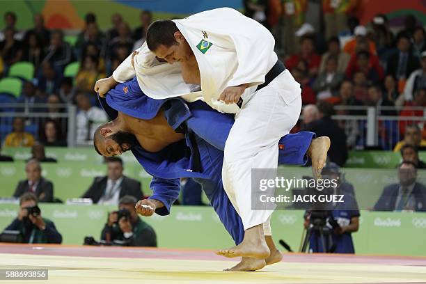 Brazil's Rafael Silva competes with Netherlands' Roy Meyer during their men's +100kg judo contest repechage match of the Rio 2016 Olympic Games in...