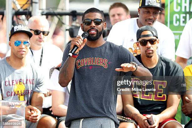 Kyrie Irving of the Cleveland Cavaliers speaks during the Cleveland Cavaliers 2016 NBA Championship victory parade and rally on June 22, 2016 in...