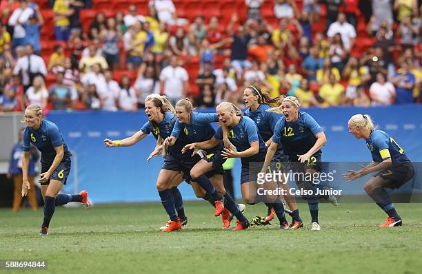 Team Sweden celebrates their 1-1 win over team United States during the Women's Football Quarterfinal match at Mane Garrincha Stadium on Day 7 of the...