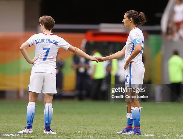 Meghan Klingenberg and Carli Lloyd of United States show camaraderie after the 1-1 loss to Sweden during the Women's Football Quarterfinal match at...