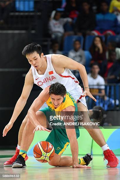 Australia's guard Damian Martin loses his balance during a Men's round Group A basketball match between China and Australia at the Carioca Arena 1 in...
