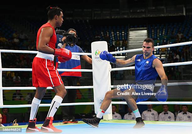 Arlen Lopez of Cuba knocks out Zoltan Adam Harcsa of Hungary during the Men's Middleweight Preliminaries bout on Day 7 of the 2016 Rio Olympics at...