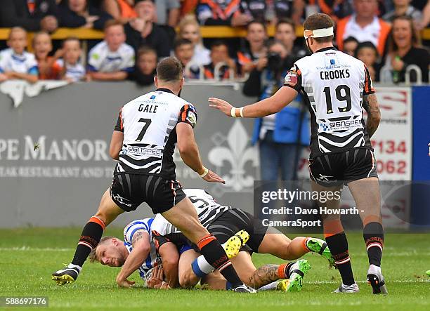 Wigan Warriors' Dominic Manfredi is tackled by Castleford Tigers' Rangi Chase which resulted in the Wigan player being taken off injured during the...