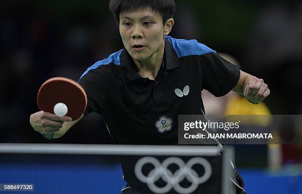 Taiwan's Cheng I-Ching hits a shot in the women's team qualification round table tennis match against Hong Kong at the Riocentro venue during the Rio...