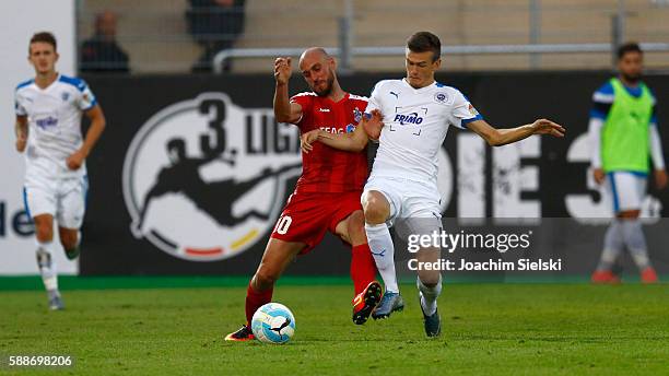 Dennis Engel of Lotte challenges Daniel Brueckner of Erfurt during the third league match between SF Lotte and Rot-Weiss Erfurt at Frimo Stadion on...