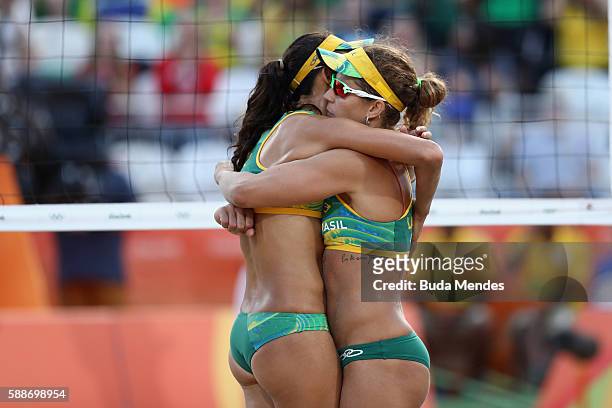 Larissa Franca Maestrini and Talita Rocha of Brazil celebrate a point during the Women's Round of 16 match against Karla Borger and Britta Buthe of...
