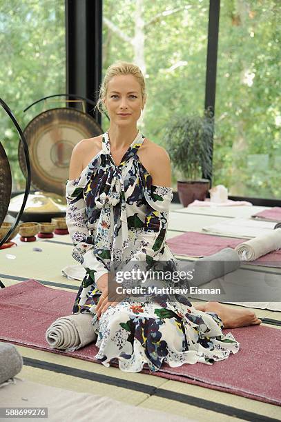 Model Carolyn Murphy attends the Buick celebration of the new Envision in the Hamptons at Buick Studio Envision on August 12, 2016 in East Hampton,...