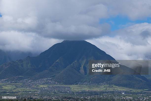 west maui mountains under clouds - kahului maui stock pictures, royalty-free photos & images