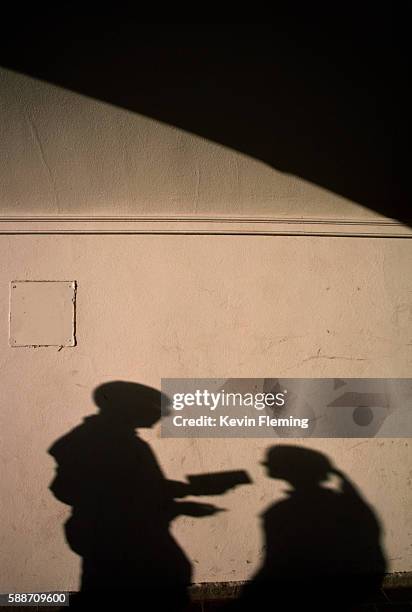 shadows of students on wall - newark stock pictures, royalty-free photos & images