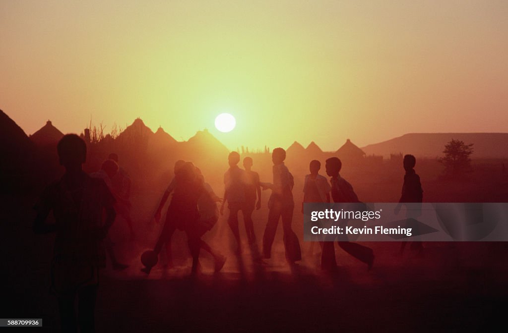 Playing Soocer at Sunset