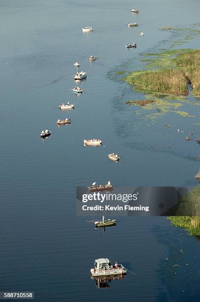 overview of fishing boats on lake okeechobee - okeechobee, florida stock pictures, royalty-free photos & images