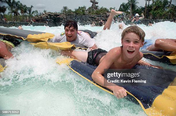 children at typhoon lagoon at disney world - typhoon lagoon stock pictures, royalty-free photos & images