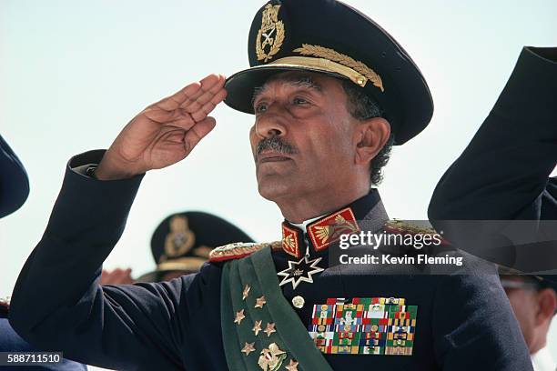 President Anwar Sadat of Egypt at a military review parade shortly before he was assassinated by soldiers in the parade.
