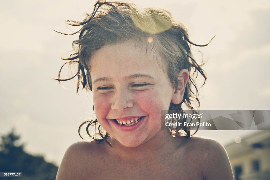 Young boy laughing.