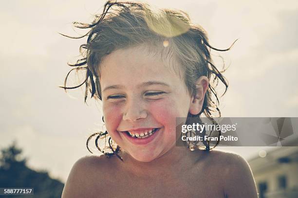 Young boy laughing.