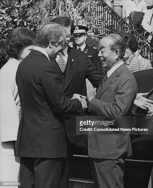 Japanese Prime Minister Takeo Fukuda is greeted by US President Jimmy Carter upon his arrival at the White House in Washington, DC, 21st March 1977....