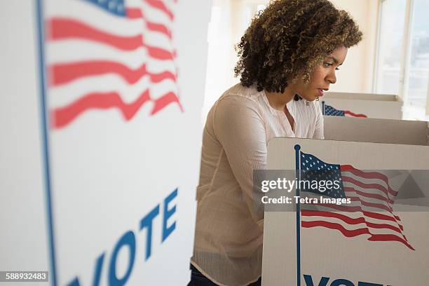 young woman preparing voting booth - votes for women 個照片及圖片檔