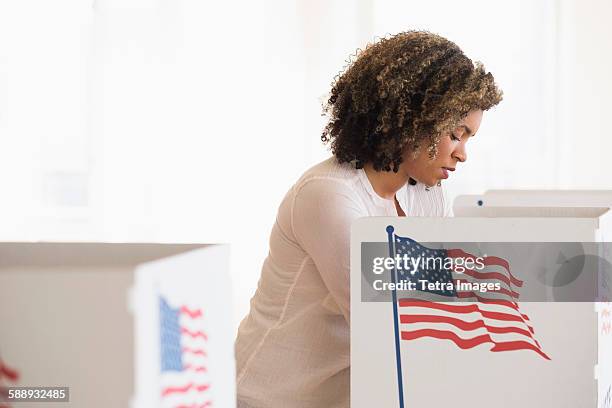 young woman preparing voting booth - election day 個照片及圖片檔