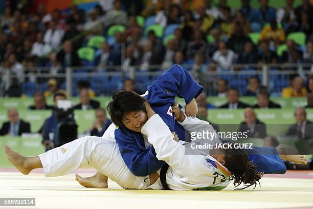 Japan's Kanae Yamabe competes with Turkey's Kayra Sayit during their women's +78kg judo contest bronze medal A match of the Rio 2016 Olympic Games in...