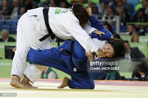 Japan's Kanae Yamabe competes with Turkey's Kayra Sayit during their women's +78kg judo contest bronze medal A match of the Rio 2016 Olympic Games in...