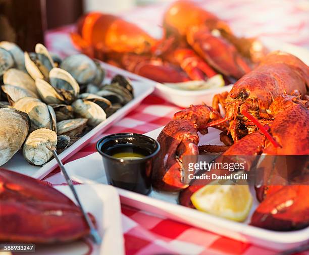 view of table with lobster meal - lobster seafood stock pictures, royalty-free photos & images