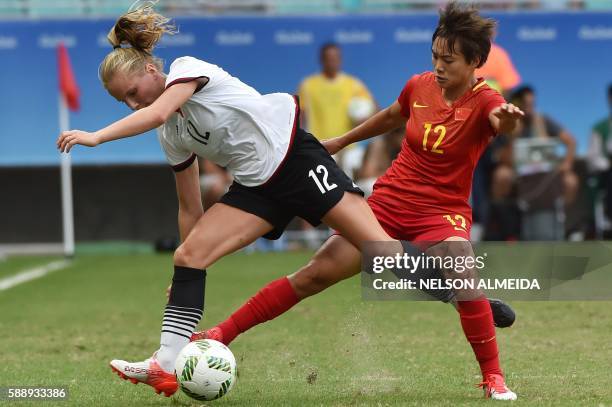 Tabea Kemme of Germany vies for the ball with Shuang Wang of China during their Rio 2016 Olympic Games women's quarter-final football match at the...