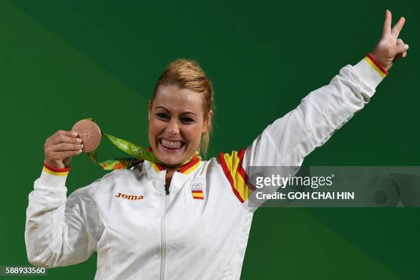 Spain's bronze medallist Lidia Valentin Perez poses on the podium after the women's weightlifting 75kg event during the Rio 2016 Olympics Games in...