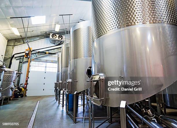 stainless steel tanks in winery cellar - fermentation tank stock pictures, royalty-free photos & images