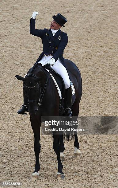 Isabell Werth of Germany riding Weihegold Old celebrates as they win the team gold during the final day of the Dressage Grand Prix event on Day 7 of...