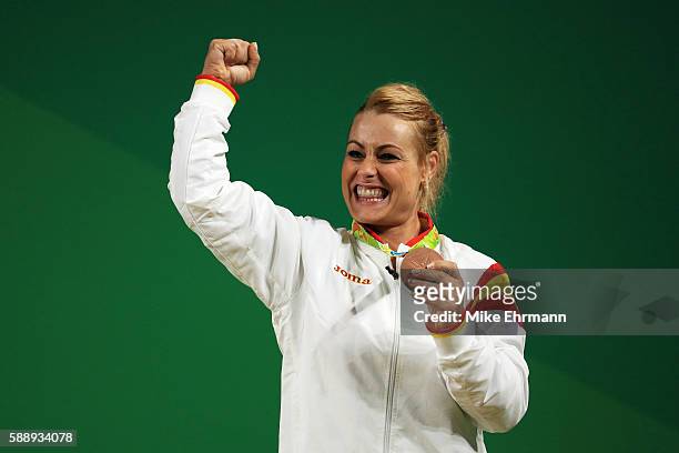 Bronze medalist Lidia Valentin Perez of Spain celebrates on the podium during the medal ceremony for the Weightlifting - Women's 75kg on Day 7 of the...