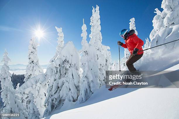 mature woman on ski slope at sunlight - whitefish montana stock pictures, royalty-free photos & images